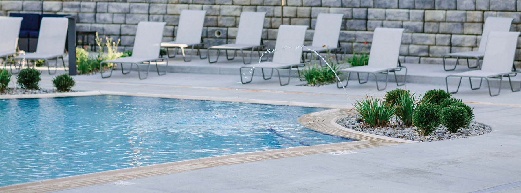 pool with lounge chairs